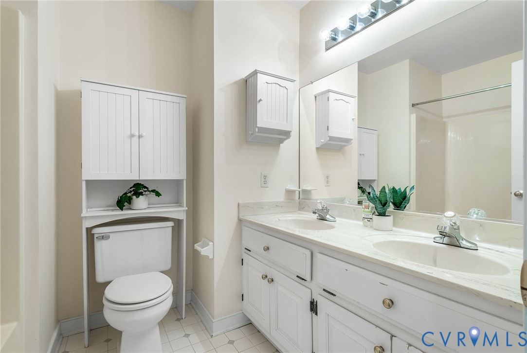 1608 Fairfield Green Road Henrico, VA 23238 - Photo 29 of 35 a bathroom with a toilet sink and mirror