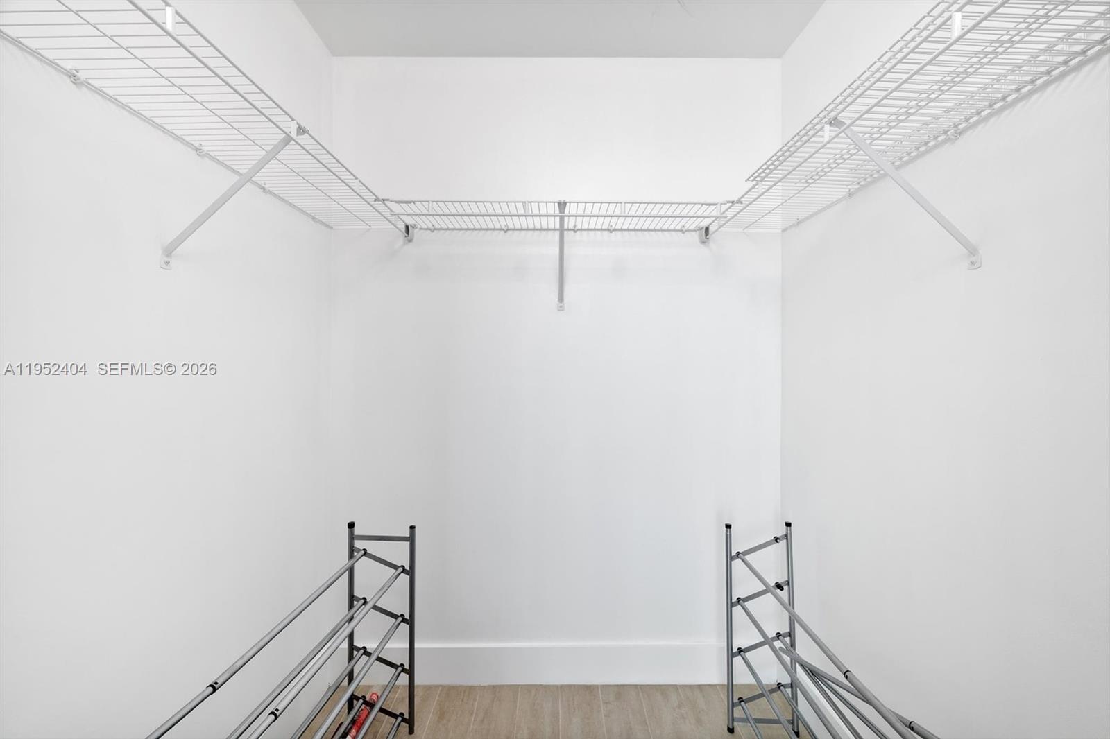 79 Southwest 12th Street, Unit 4004S Miami, FL 33130 - Photo 21 of 29 a view of a room with racks on the wall