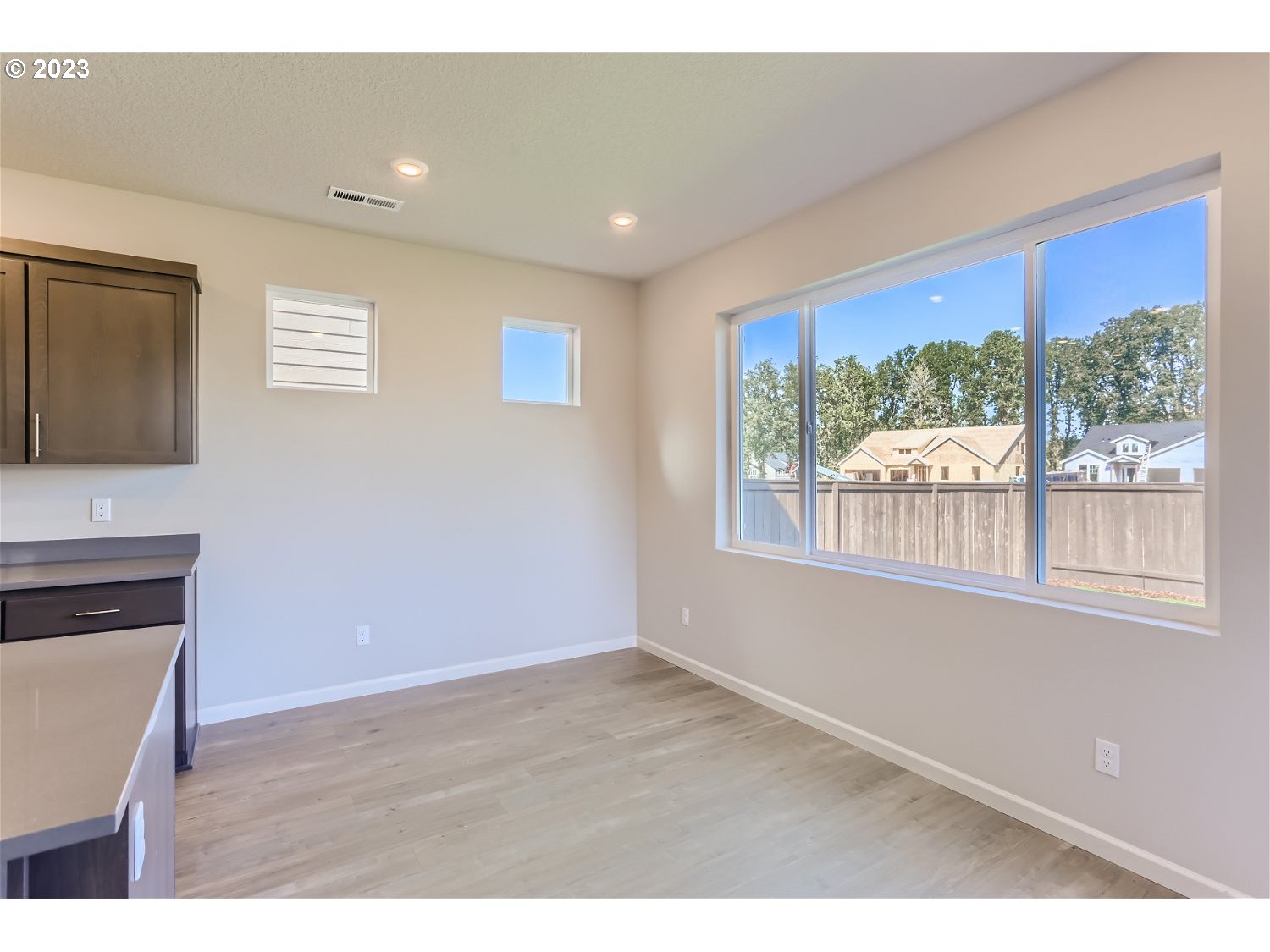 2772 Northeast Hill Road McMinnville, OR 97128 - Photo 7 of 26 a view of an empty room with wooden floor and a window