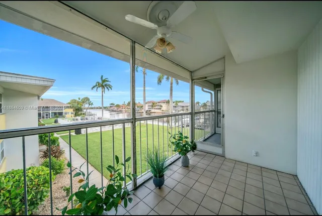 a view of a balcony with plants