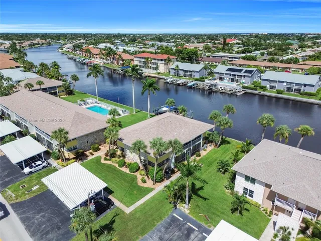 an aerial view of a house with a lake view