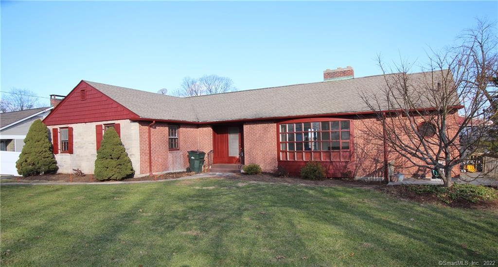 902 Ridge Road Wethersfield, CT 06109 - Photo 1 of 1 a front view of a house with a yard