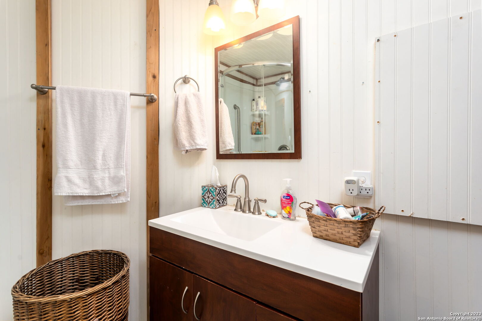 8417 Highway 16 Bandera, TX 78003 - Photo 17 of 28 a bathroom with a sink vanity granite and a mirror