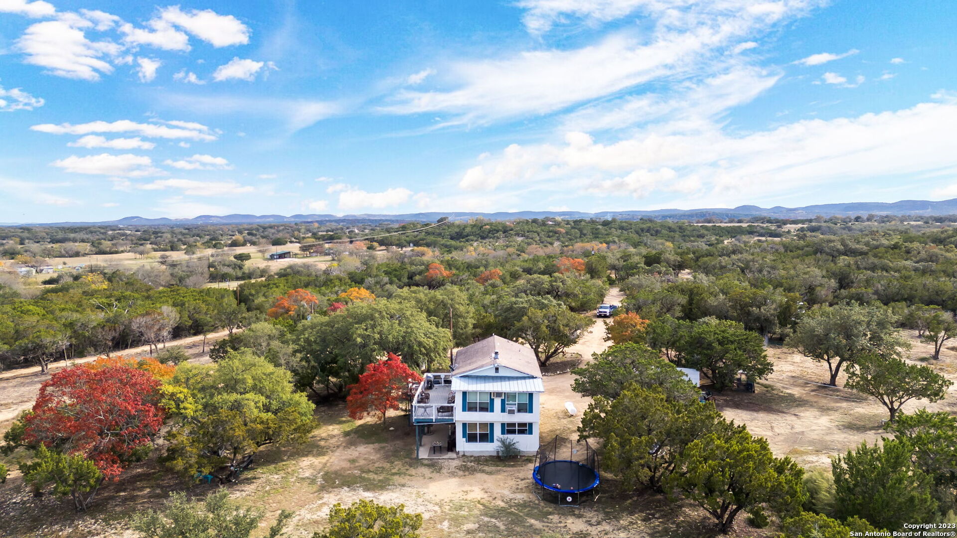 8417 Highway 16 Bandera, TX 78003 - Photo 5 of 28 an aerial view of a house with a garden