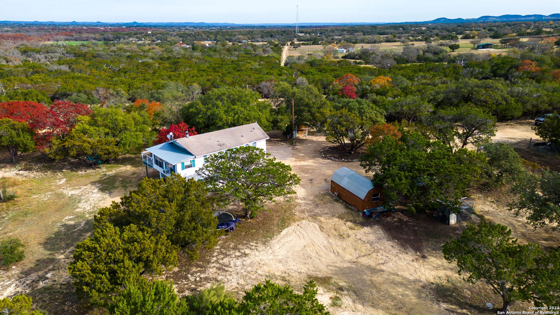 8417 Highway 16 Bandera, TX 78003 - Photo 8 of 28 an aerial view of a houses with a yard