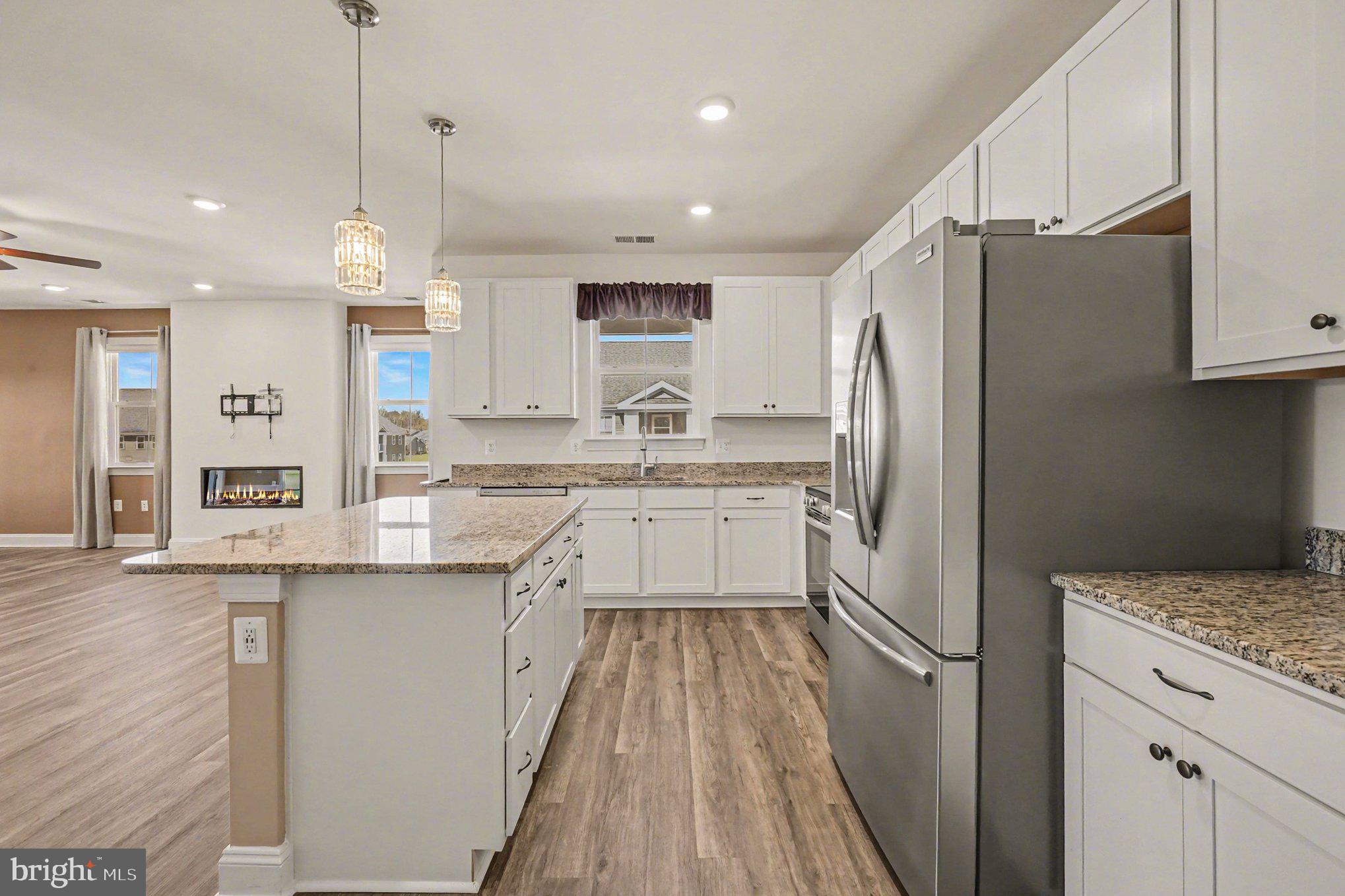 406 Bold Ruler Court, Unit 402 Havre de Grace, MD 21078 - Photo 11 of 59 a kitchen with a refrigerator a sink and cabinets