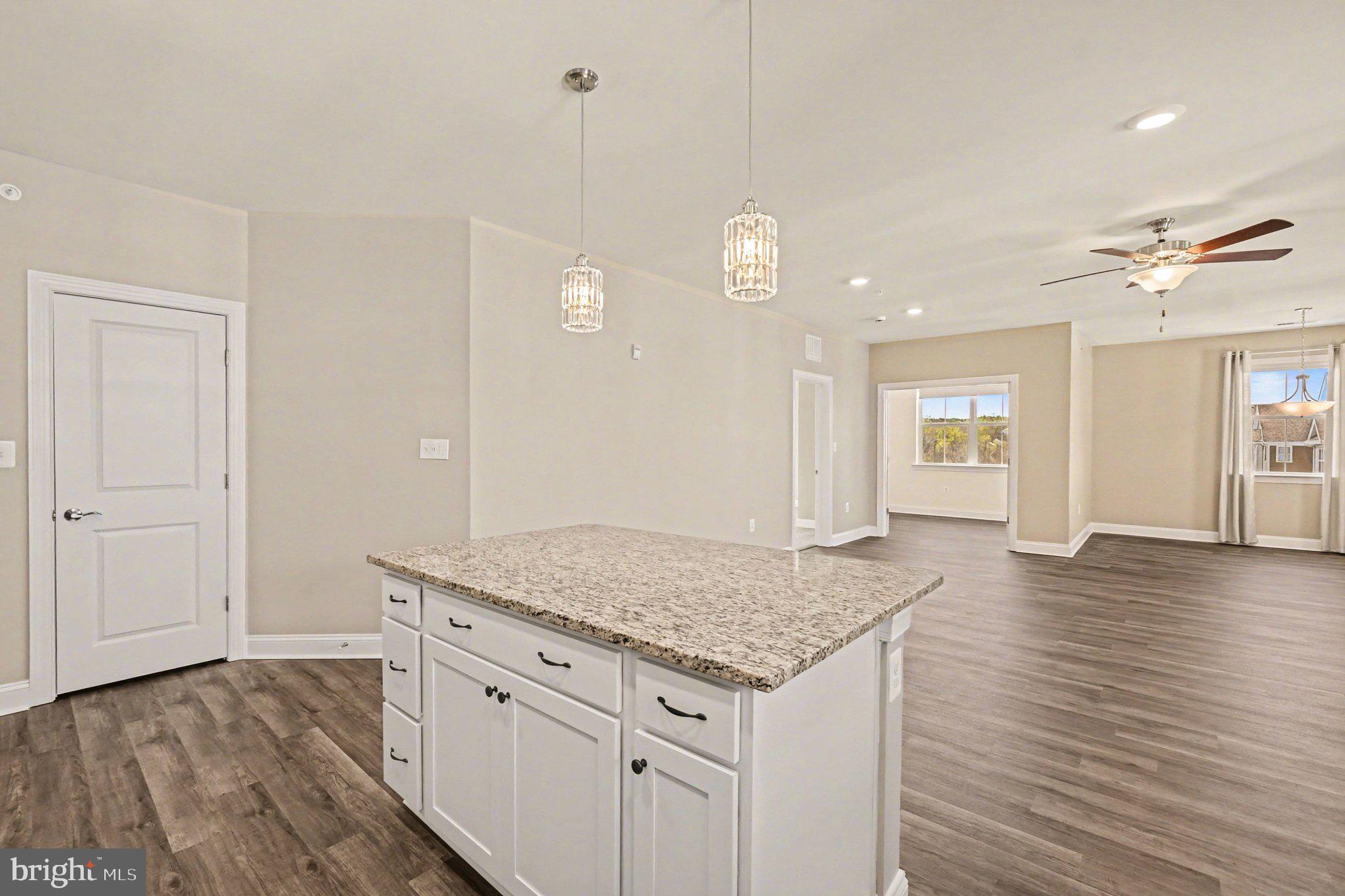 406 Bold Ruler Court, Unit 402 Havre de Grace, MD 21078 - Photo 13 of 59 a view of kitchen island with wooden floor