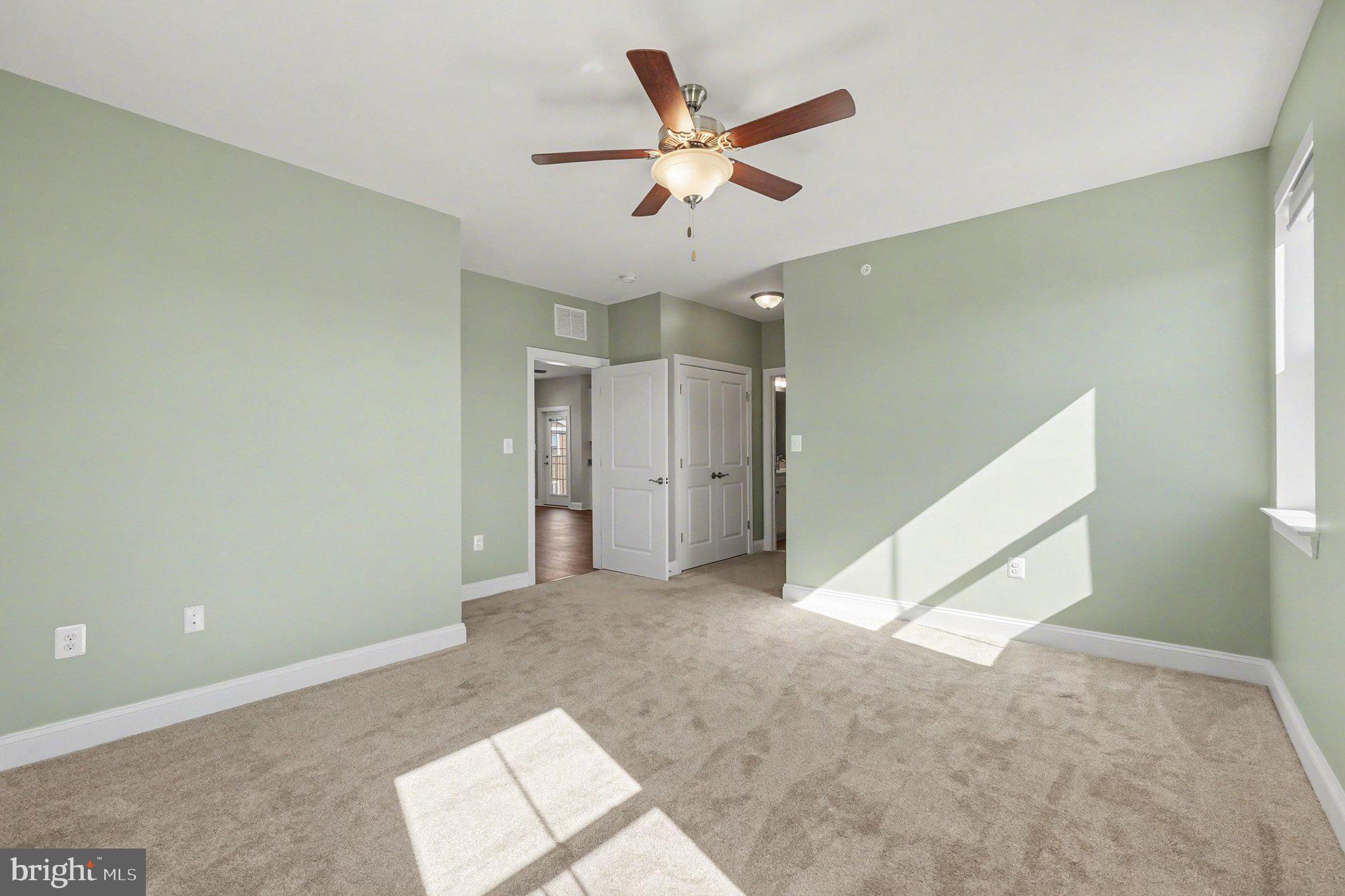 406 Bold Ruler Court, Unit 402 Havre de Grace, MD 21078 - Photo 19 of 59 an empty room with closet and ceiling fan