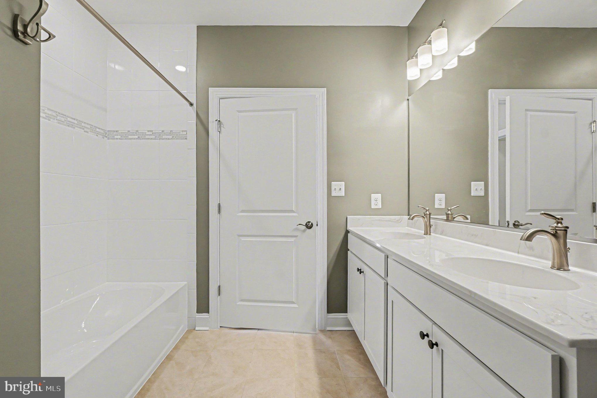 406 Bold Ruler Court, Unit 402 Havre de Grace, MD 21078 - Photo 20 of 59 a bathroom with a tub sink and mirror
