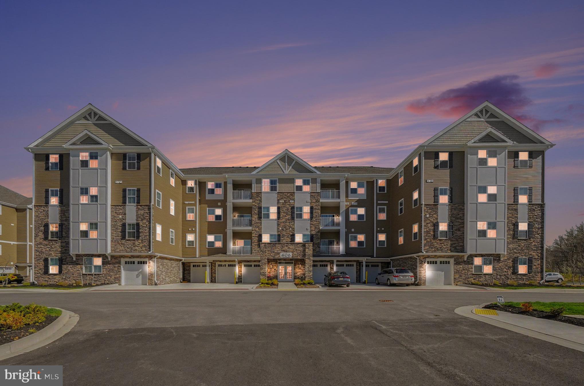 406 Bold Ruler Court, Unit 402 Havre de Grace, MD 21078 - Photo 2 of 59 a front view of a building with street