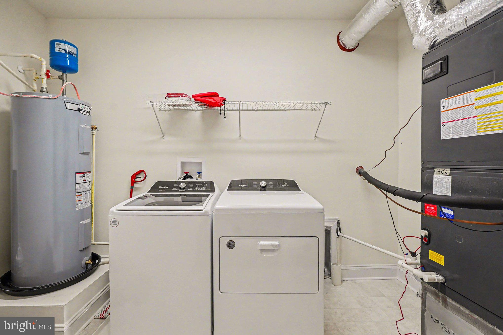 406 Bold Ruler Court, Unit 402 Havre de Grace, MD 21078 - Photo 27 of 59 a utility room with dryer and washer