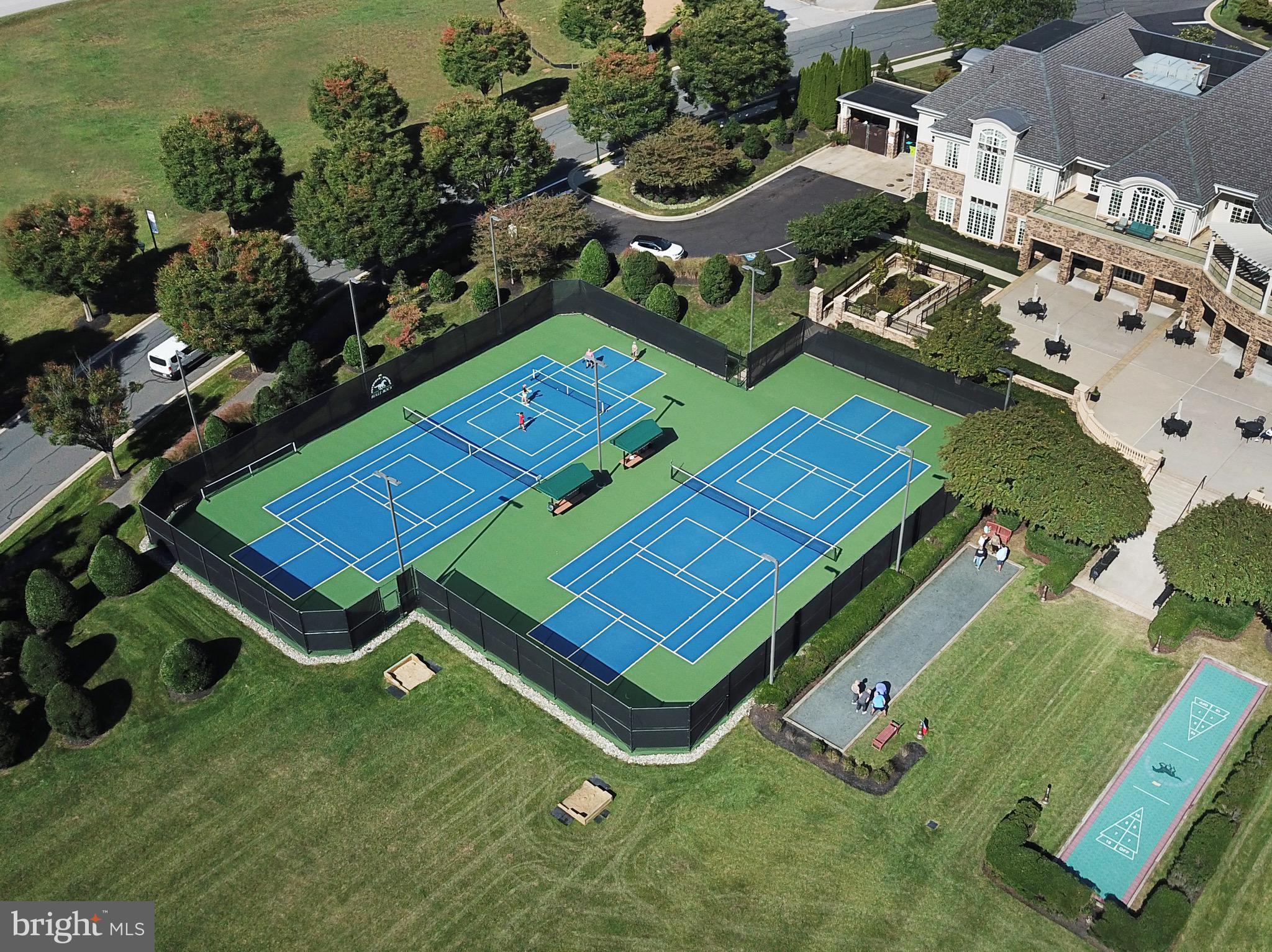 406 Bold Ruler Court, Unit 402 Havre de Grace, MD 21078 - Photo 38 of 59 an aerial view of a tennis ground and a large pool