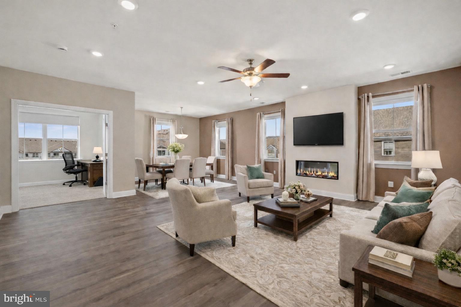 406 Bold Ruler Court, Unit 402 Havre de Grace, MD 21078 - Photo 6 of 59 a living room with furniture a flat screen tv and a fireplace