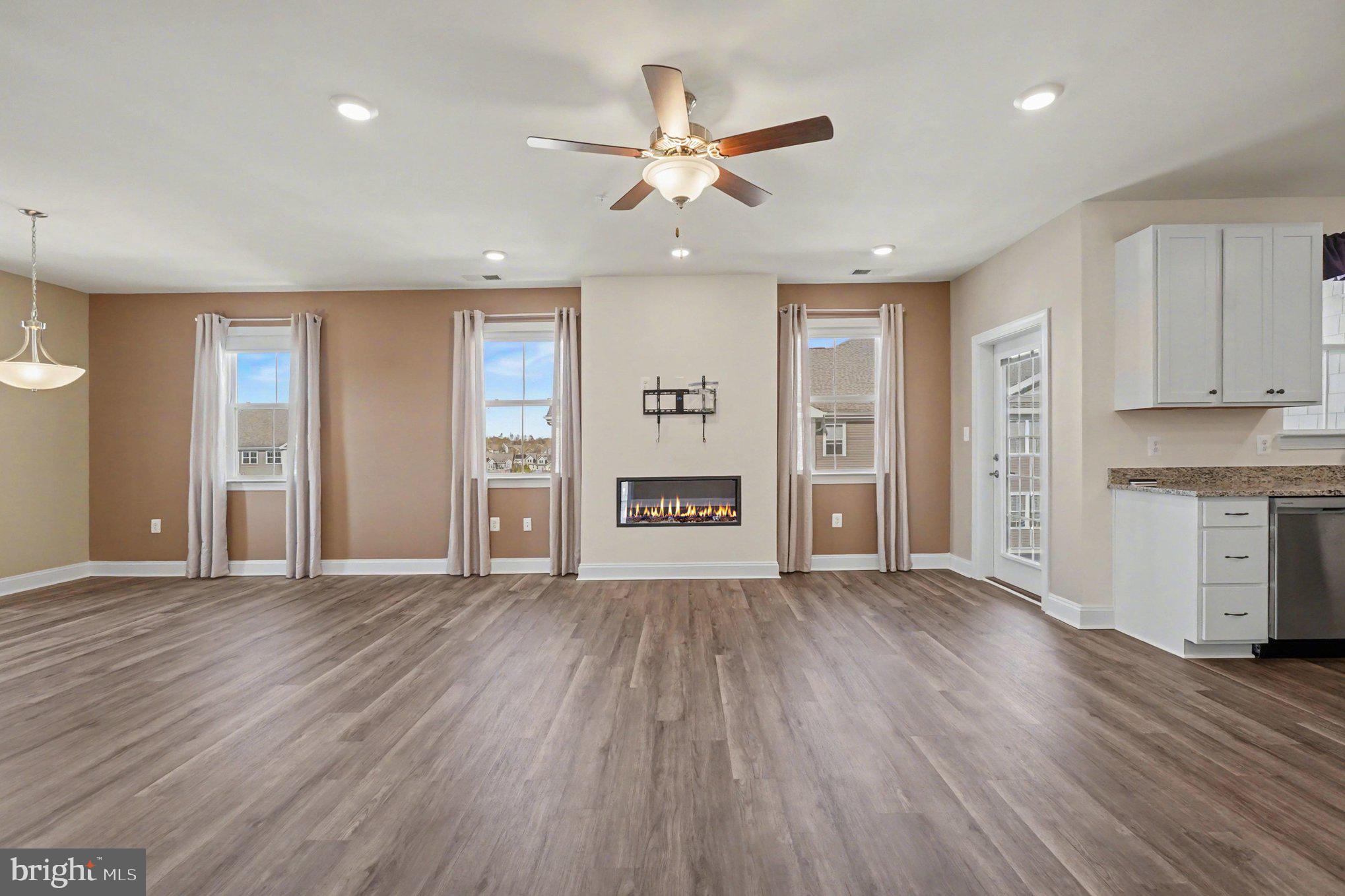 406 Bold Ruler Court, Unit 402 Havre de Grace, MD 21078 - Photo 8 of 59 a view of an empty room with a window and wooden floor
