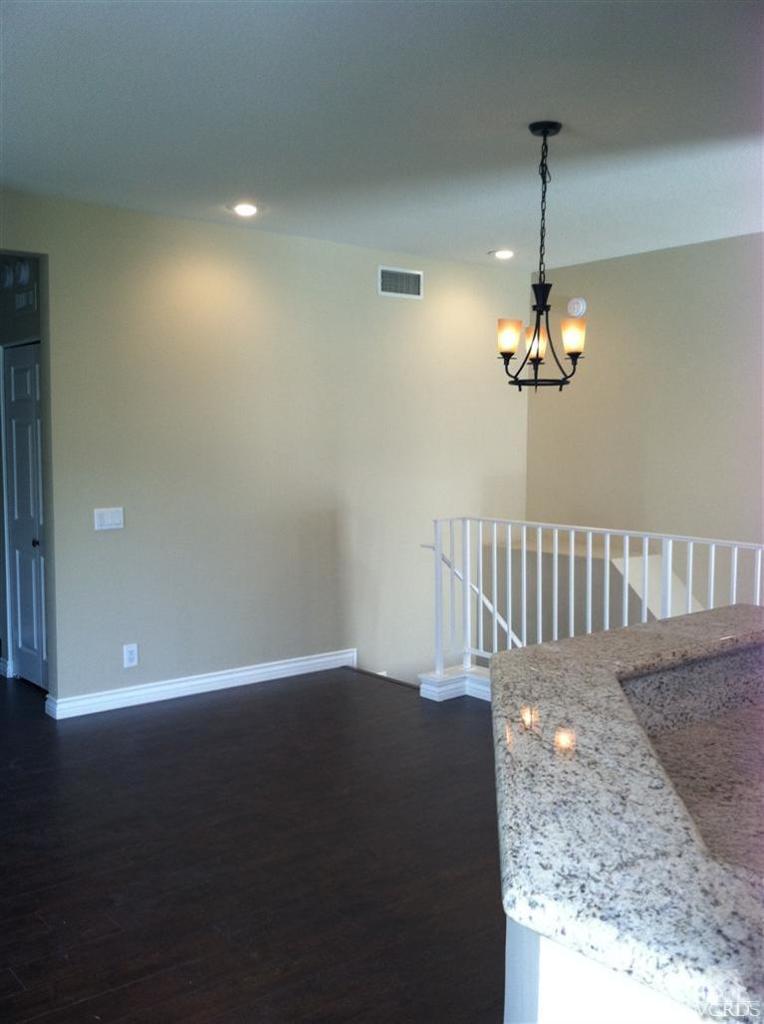 4249 Rusticview Court Moorpark, CA 93021 - Photo 4 of 7 a view of a hallway with a chandelier