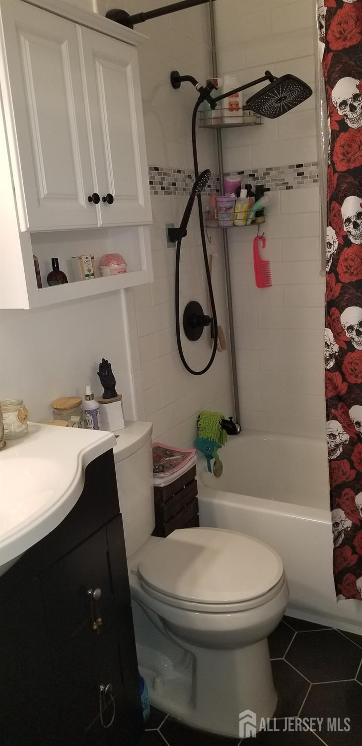 30 Judson Street, Unit 6A Edison, NJ 08837 - Photo 11 of 14 a bathroom with a sink a toilet and shower