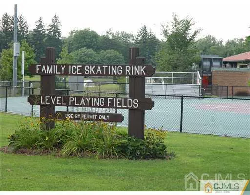 a view of a sign board with yard