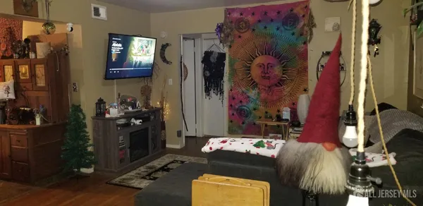 a living room with furniture and a bed