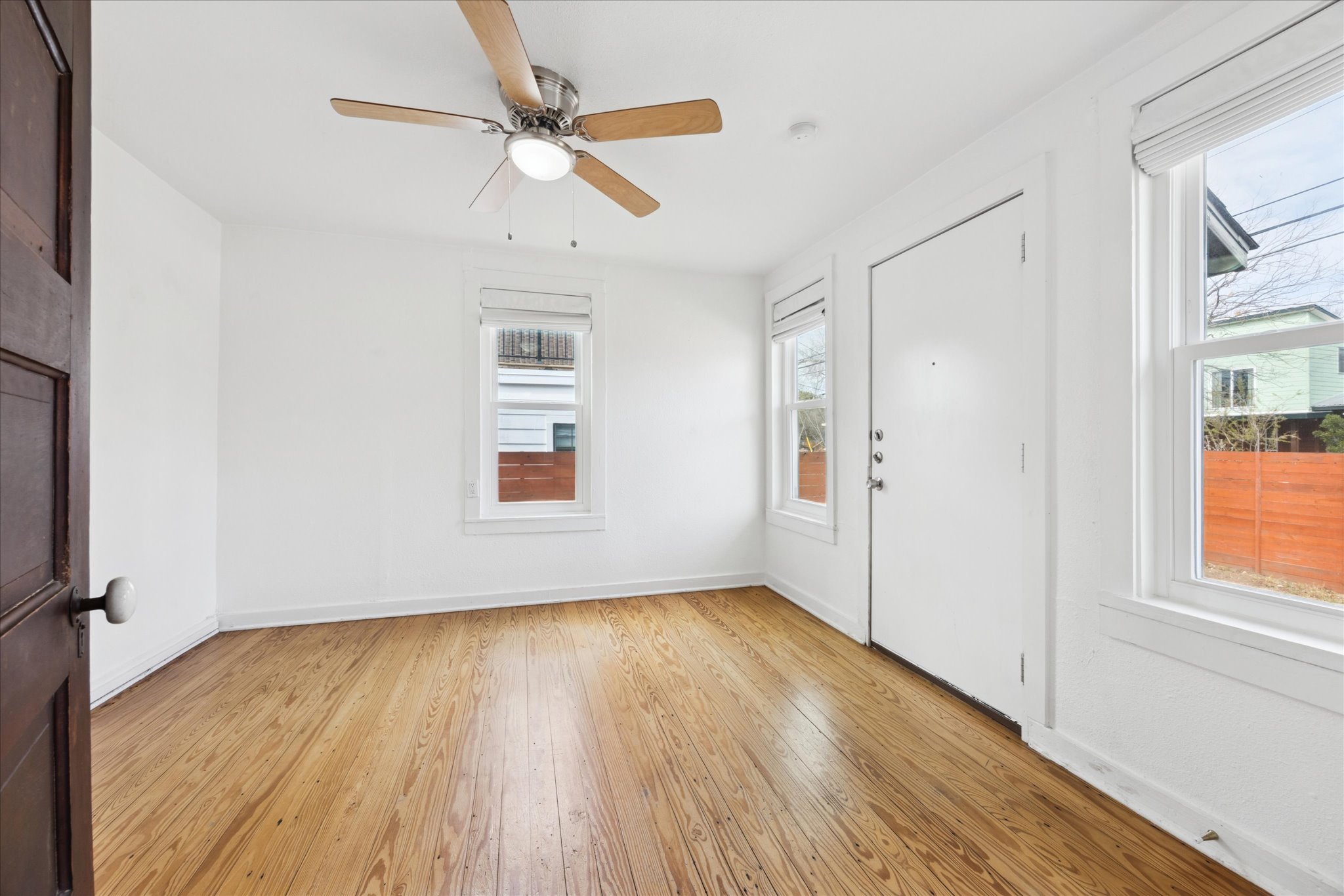 1210 Coleto Street Austin, TX 78702 - Photo 13 of 24 Second bedroom at the back of the house with a door to access the back yard