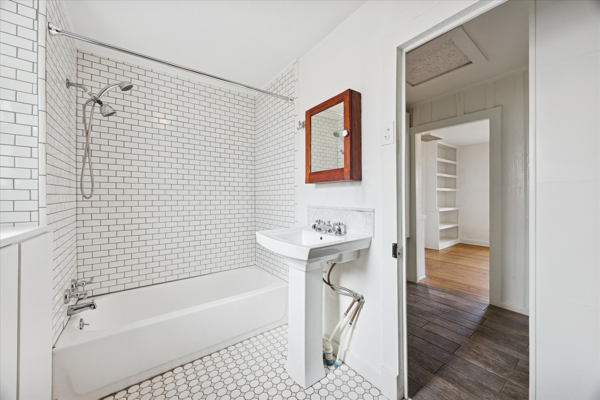 1210 Coleto Street Austin, TX 78702 - Photo 10 of 22 a bathroom with a bathtub and a shower
