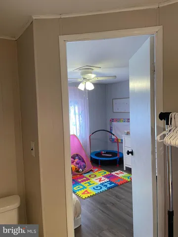 a bedroom with a bed and a view of bathroom