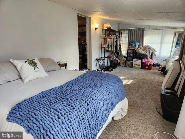 a bed room with a bed and a window