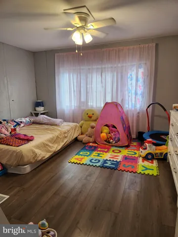 a bedroom with bed and a window