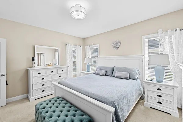 a bathroom with double vanity sinks and a mirror