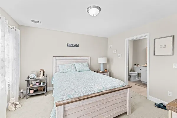 a potted plant sitting on the side of a brick house