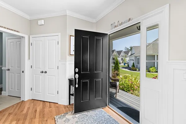 a living room with furniture a fireplace and window