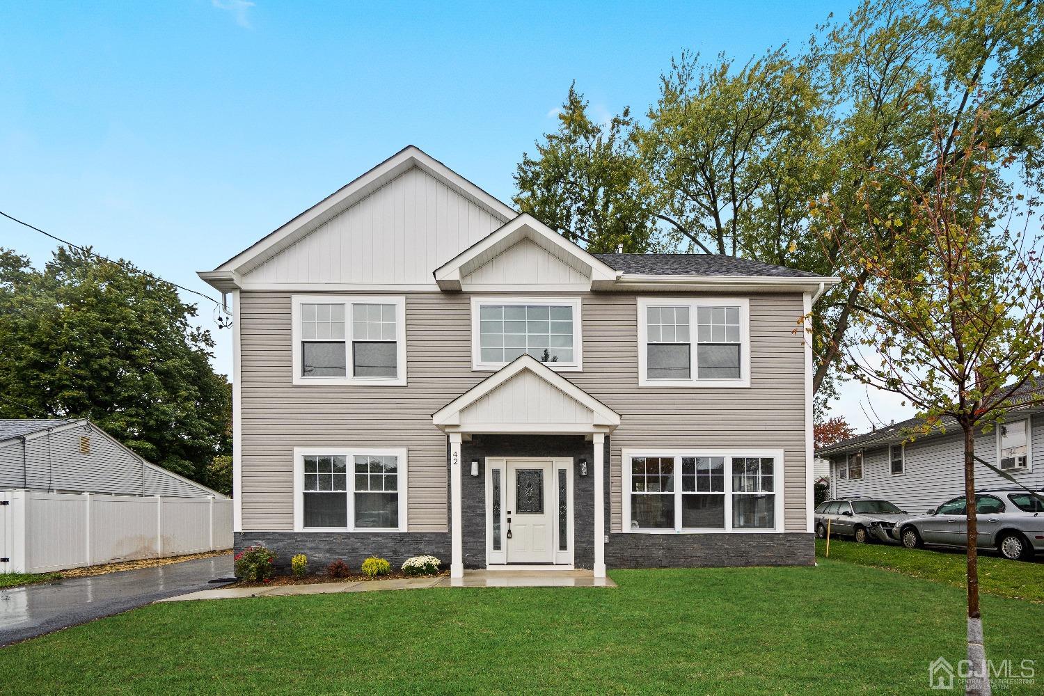 front view of a house with a yard
