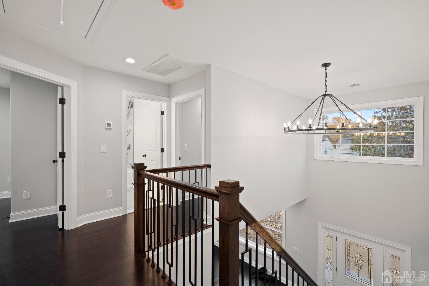 42 Wayne Street Edison, NJ 08817 - Photo 11 of 22 a view of a hallway with wooden floor and entryway