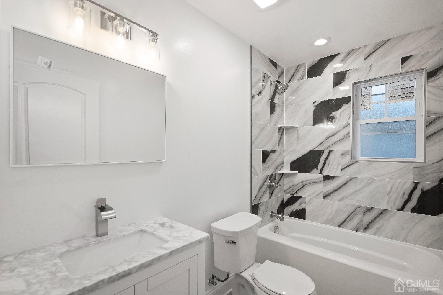 42 Wayne Street Edison, NJ 08817 - Photo 14 of 22 a bathroom with a sink toilet and shower