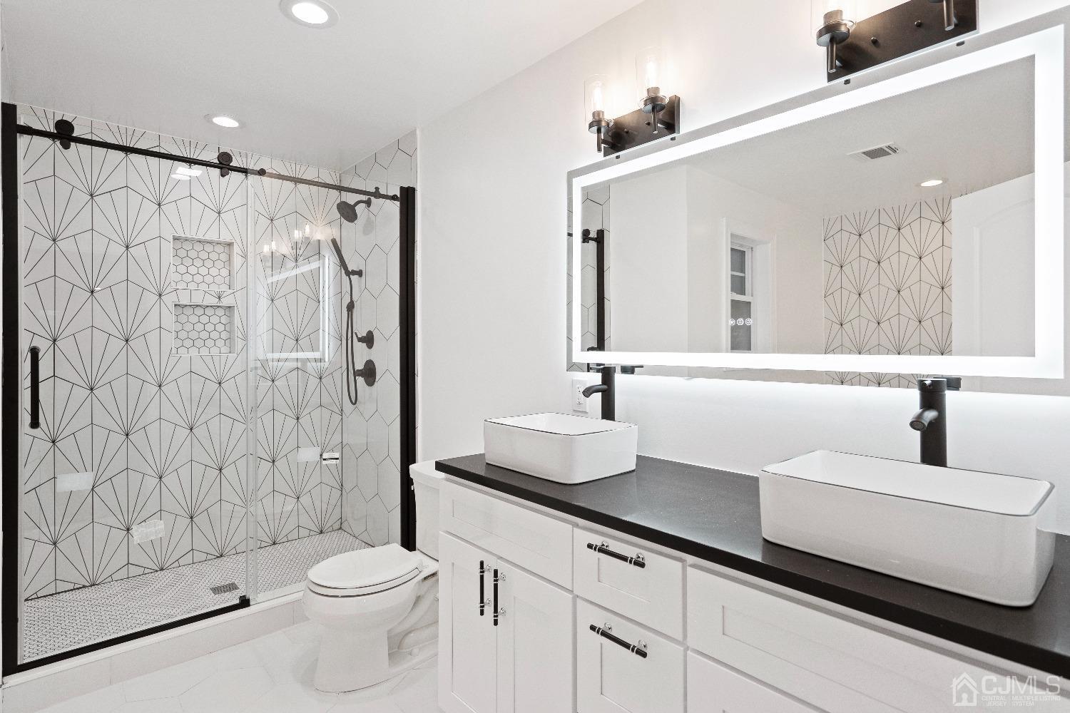 42 Wayne Street Edison, NJ 08817 - Photo 20 of 22 a bathroom with a sink and a mirror