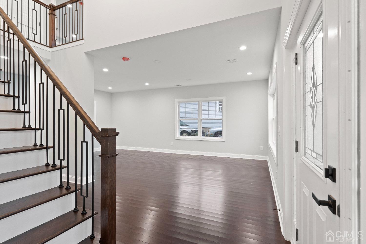 42 Wayne Street Edison, NJ 08817 - Photo 2 of 22 a view of an entryway with wooden floor and stairs