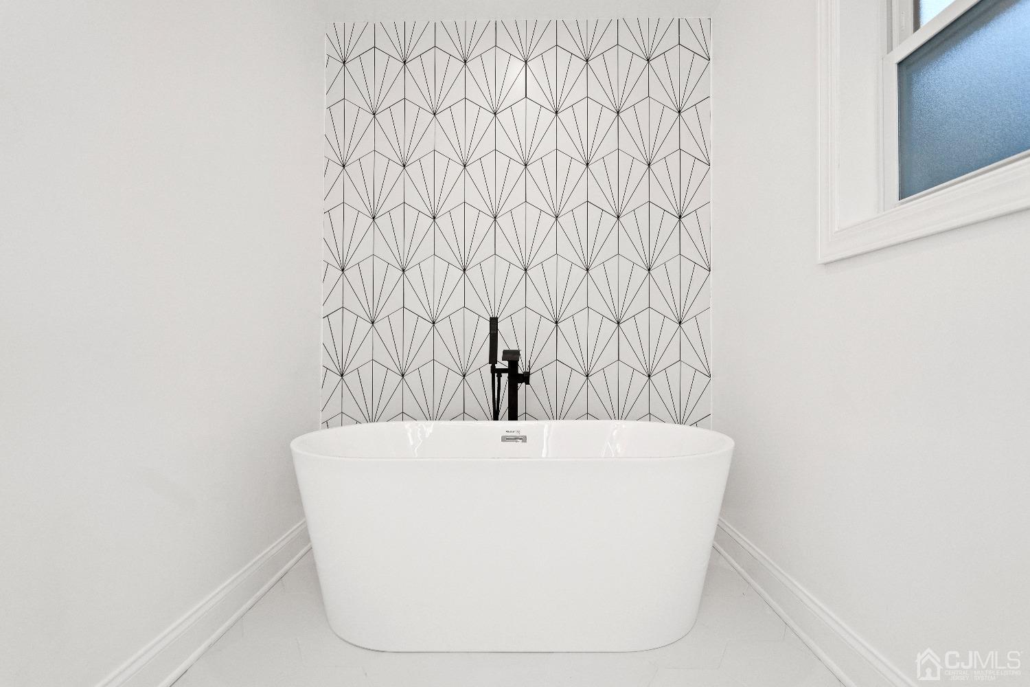 42 Wayne Street Edison, NJ 08817 - Photo 21 of 22 a white bath tub sitting in a bathroom