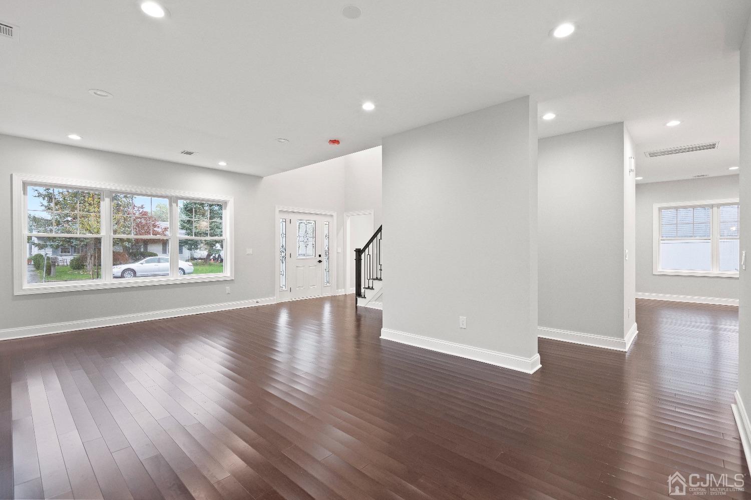 42 Wayne Street Edison, NJ 08817 - Photo 4 of 22 a view of an empty room with wooden floor and a window