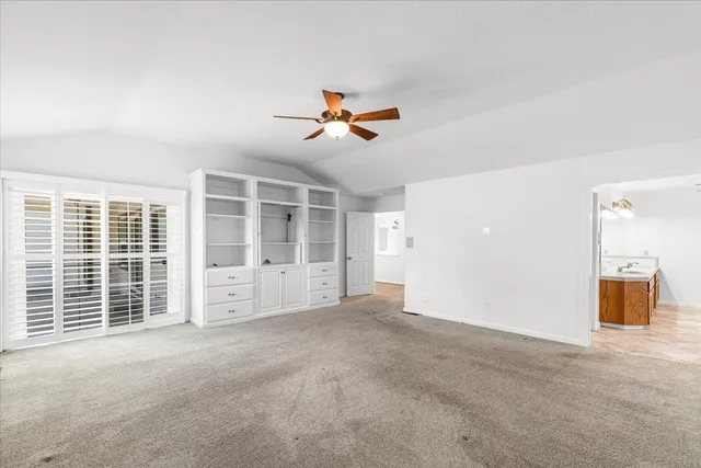 a large bathroom with a granite countertop sink mirror and shower