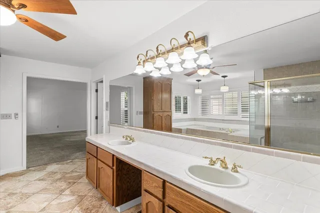 a utility room with sink dryer and washer