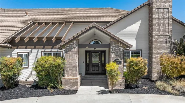 a view of a hallway view with wooden floor and furniture