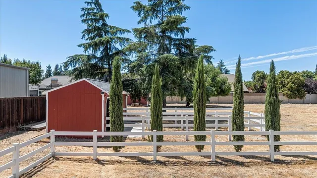 a view of a swimming pool with an outdoor seating and a garden
