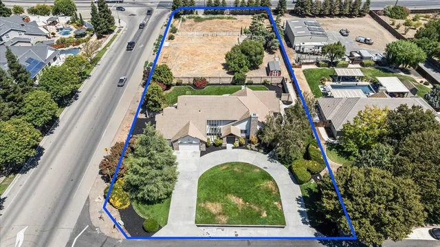 an aerial view of a house with outdoor space