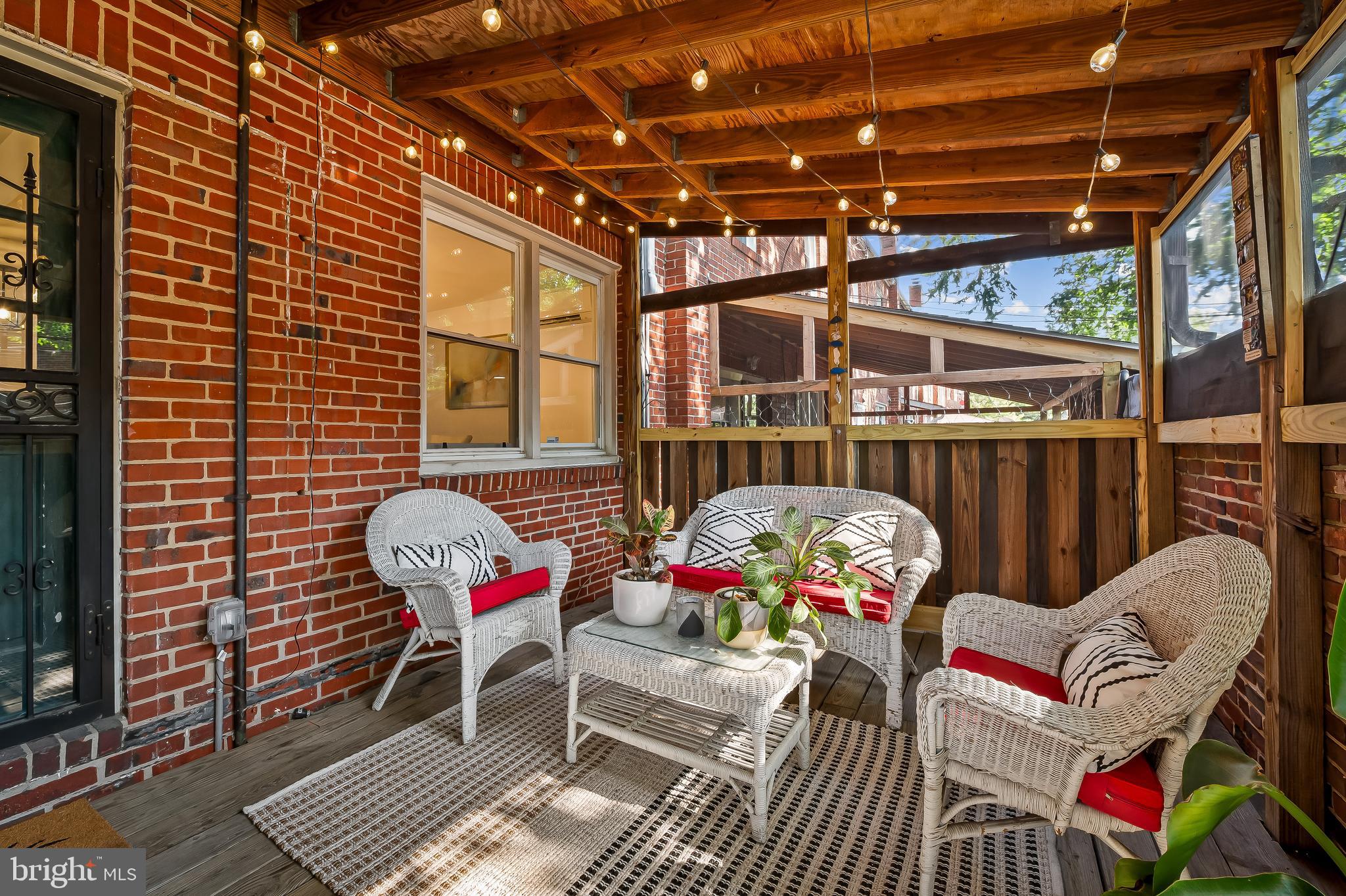 3718 Yolando Road Baltimore, MD 21218 - Photo 46 of 53 a backyard of a house with wooden floor and outdoor seating