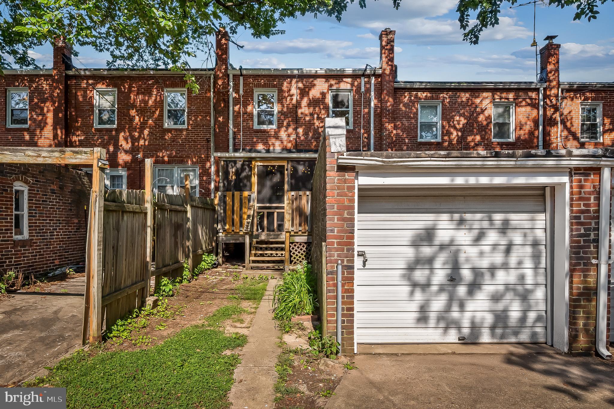 3718 Yolando Road Baltimore, MD 21218 - Photo 50 of 53 a front view of a house with a yard