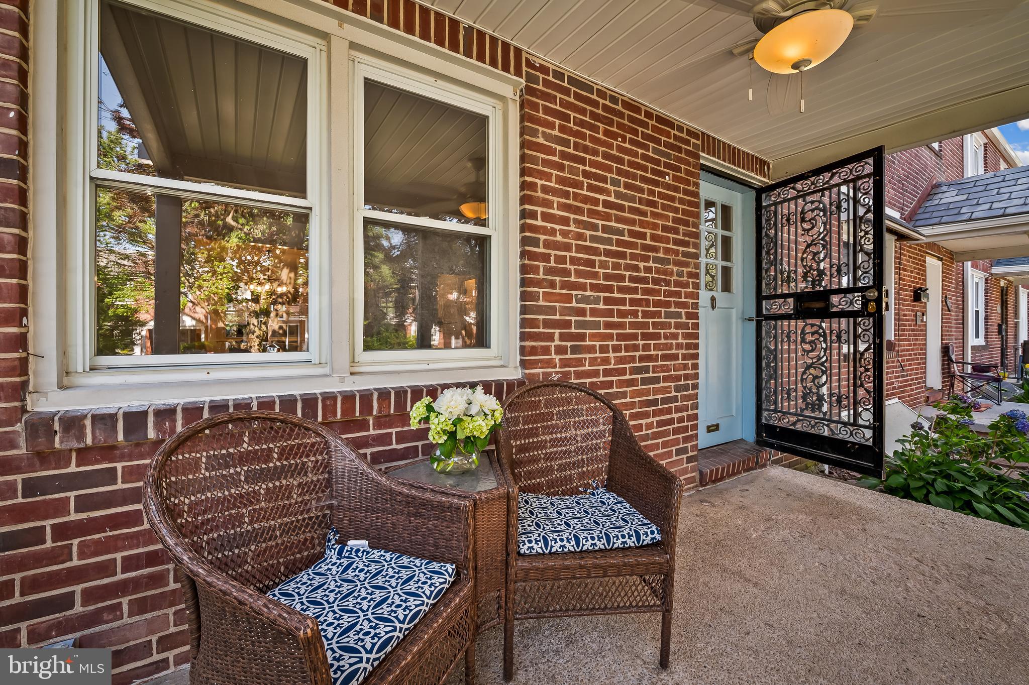 3718 Yolando Road Baltimore, MD 21218 - Photo 7 of 53 a front view of a house with outdoor seating and plants