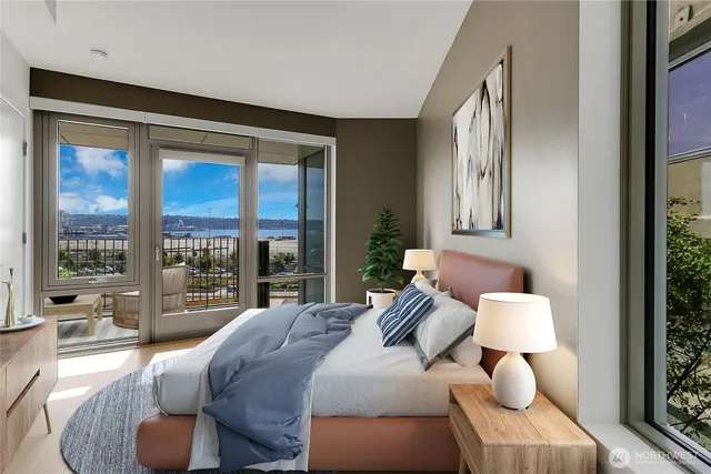 a bedroom with furniture and a large window