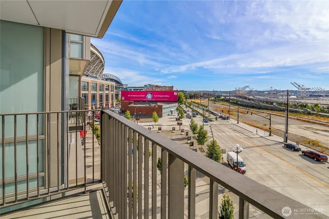 a view of a balcony with wooden floor and stairs