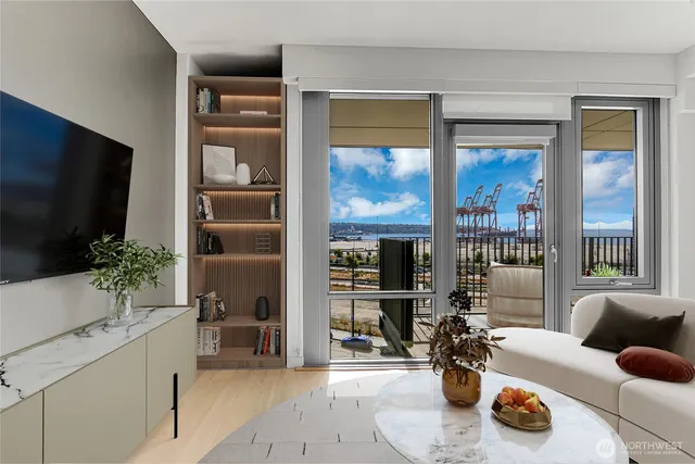a living room with furniture potted plant and a flat screen tv