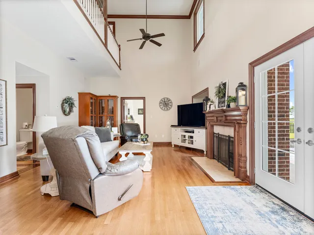a bedroom with a large bed and a chandelier