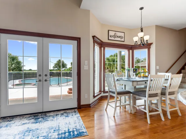 a bedroom with furniture a flat screen tv and a fireplace